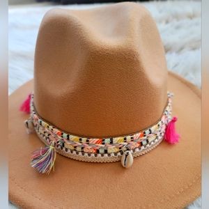 Beautiful brown fedora hat with colorful band.